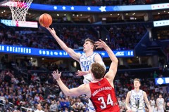 Washington, DC - March 14, 2024: Duke Blue Devils center Kyle Filipowski (30) makes a layup during the quarterfinal round of the 2024 ACC Tournament between Duke and NC State at Capital One Arena in Washington, DC.  (Photo by Elliott Brown/A Lot of Sports Talk)