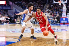 Washington, DC - March 14, 2024: North Carolina State Wolfpack guard Casey Morsell (14) drives to the basket during the quarterfinal round of the 2024 ACC Tournament between Duke and NC State at Capital One Arena in Washington, DC.  (Photo by Elliott Brown/A Lot of Sports Talk)