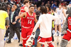 Washington, DC - March 14, 2024: North Carolina State Wolfpack guard Casey Morsell (14) celebrates after the quarterfinal round of the 2024 ACC Tournament between Duke and NC State at Capital One Arena in Washington, DC.  (Photo by Elliott Brown/A Lot of Sports Talk)