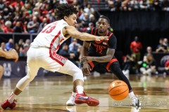 March 14, 2024: San Diego State Aztecs guard Darrion Trammell (12) makes a bounce pass during the first half of the Men’s Quarterfinals of the Mountain West Conference tournament, Thursday, March 14, 2024, in Las Vegas, NV. Christopher Trim/A Lot of Sports Talk.