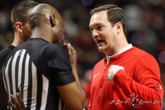 March 14, 2024: UNLV Rebels head coach Kevin Kruger speaks to a referee during the second half of the Men’s Quarterfinals of the Mountain West Conference tournament, Thursday, March 14, 2024, in Las Vegas, NV. Christopher Trim/A Lot of Sports Talk.