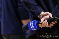 March 14, 2024: A reporter holds a microphone during the first half of the Men’s Quarterfinals of the Mountain West Conference tournament, Thursday, March 14, 2024, in Las Vegas, NV. Christopher Trim/A Lot of Sports Talk.