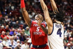 March 14, 2024: Fresno State Bulldogs guard Jalen Weaver (5) shoots over Utah State Aggies guard Ian Martinez (4) during the first half of the Men’s Quarterfinals of the Mountain West Conference tournament, Thursday, March 14, 2024, in Las Vegas, NV. Christopher Trim/A Lot of Sports Talk.