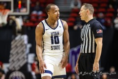 March 14, 2024: Utah State Aggies guard Darius Brown II (10) speaks with the referee during the first half of the Men’s Quarterfinals of the Mountain West Conference tournament, Thursday, March 14, 2024, in Las Vegas, NV. Christopher Trim/A Lot of Sports Talk.