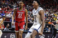 March 14, 2024: Utah State Aggies forward Great Osobor (1) celebrates after dunking the ball during the second half of the Men’s Quarterfinals of the Mountain West Conference tournament, Thursday, March 14, 2024, in Las Vegas, NV. Christopher Trim/A Lot of Sports Talk.