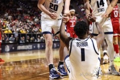 March 14, 2024: Utah State Aggies forward Great Osobor (1) is helped up after being fouled during the second half of the Men’s Quarterfinals of the Mountain West Conference tournament, Thursday, March 14, 2024, in Las Vegas, NV. Christopher Trim/A Lot of Sports Talk.