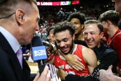 March 16, 2024: New Mexico Lobos guard Jaelen House (10) holds the MVP trophy while being hugged by New Mexico Lobos head coach Richard Pitino after winning the Men’s Mountain West Conference tournament, Saturday, March 16, 2024, in Las Vegas, NV. Christopher Trim/A Lot of Sports Talk.