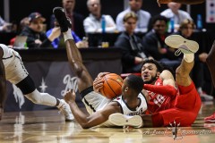 March 16, 2024: San Diego State Aztecs guard Lamont Butler (5) and New Mexico Lobos guard Jaelen House (10) battle for a loose ball during the second half of the Men’s Finals of the Mountain West Conference tournament, Saturday, March 16, 2024, in Las Vegas, NV. Christopher Trim/A Lot of Sports Talk.