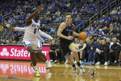 During the Big East Conference game between Seton Hall and Marquette, Marquette guard TYLER KOLEK (11) drives  to the basket past Seton Hall forward DAVID TUBEK (6) during the second half of the game  at the Prudential Center in Newark, New Jersey
