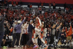 During the ACC conference basketball game between Syracuse University and Miami University, Syracuse celebrates their victory with the fans at the end of the game held at the JMA Wireless Dome on the campus of Syracuse University.