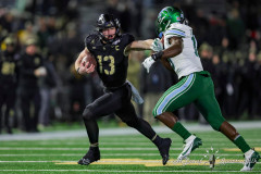 Army Black Knights quarterback BRYSON DAILY (13) stiff arms a defender while running during the American Athletic Conference football championship game held on the campus of Army Black Knights at West Point. Army Black Knights quarterback BRYSON DAILY (13) stiff arms a defender while running during the American Athletic Conference football championship game held on the campus of Army Black Knights at West Point.