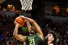 March 15, 2024: New Mexico Lobos forward Mustapha Amzil (22) blocks a shot by Colorado State Rams guard Rashaan Mbemba (21) during the second half of the Men’s Semifinals of the Mountain West Conference tournament, Friday, March 15, 2024, in Las Vegas, NV. Christopher Trim/A Lot of Sports Talk.