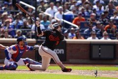 NEW YORK — AUGUST 21: Baltimore Orioles catcher Adley Rutschman (35) hits a sacrifice fly ball against the New York Mets during the eighth inning at Citi Field on August 21, 2024, in New York, New York. (Gregory Fisher/A Lot of Sports Talk)