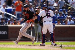 NEW YORK — AUGUST 21: Baltimore Orioles center fielder Colton Cowser (17) scores a run on Baltimore Orioles catcher Adley Rutschman (not pictured) sacrifice fly ball against the New York Mets during the eighth inning at Citi Field on August 21, 2024, in New York, New York. (Gregory Fisher/A Lot of Sports Talk)