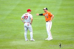 Baltimore, MD - July 9, 2022: Baltimore Orioles designated hitter Trey Mancini (16) and Los Angeles Angels center fielder Mike Trout (27) talk before the game between the Baltimore Orioles and Los Angeles Angels at  Oriole Park at Camden Yards in Baltimore, MD.   (Photo by Elliott Brown/A Lot of Sports Talk)