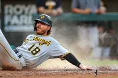 Baltimore, MD - August 6, 2022: Pittsburgh Pirates left fielder Ben Gamel (18) slides into home plate during the game between the Baltimore Orioles and Pittsburgh Pirates at  Oriole Park at Camden Yards in Baltimore, MD.   (Photo by Elliott Brown/A Lot of Sports Talk)