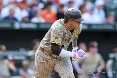 Baltimore, MD - July 27, 2024: San Diego Padres third base Manny Machado (13) runs to first base during the game between the Baltimore Orioles and San Diego Pardres at  Oriole Park at Camden Yards in Baltimore, MD.   (Photo by Elliott Brown/A Lot of Sports Talk)