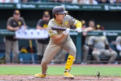 Baltimore, MD - July 27, 2024: San Diego Padres shortstop Ha-Seong Kim (7) tries to bunt the ball during the game between the Baltimore Orioles and San Diego Pardres at  Oriole Park at Camden Yards in Baltimore, MD.   (Photo by Elliott Brown/A Lot of Sports Talk)