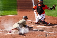 Baltimore, MD - July 27, 2024: Baltimore Orioles catcher Adley Rutschman (35) tags San Diego Padres third base Manny Machado (13) at homeplate during the game between the Baltimore Orioles and San Diego Pardres at  Oriole Park at Camden Yards in Baltimore, MD.   (Photo by Elliott Brown/A Lot of Sports Talk)