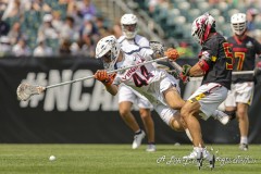 PHILADELPHIA, PENNSYLVANIA – MAY 25: Virginia defender BEN WAYER (44) gets knocked down while going for the ball by Maryland defender GEORGE STAMOS (54) in the game between Maryland and Virginia during the 2024 NCAA Men’s Lacrosse Tournament semifinal game at Lincoln Financial Field on May 25, 2024, in Philadelphia, PA  (Scotty Rausenberger/A Lot of Sports Talk)