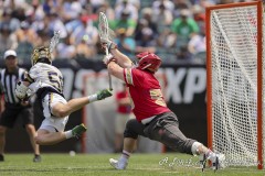 PHILADELPHIA, PENNSYLVANIA – MAY 25: Notre Dame attack CHRIS KAVANAGH (50) dives for the shot while Denver attack RICHIE CONNELL (23) unsuccessfully attempts to stop it  during the game between Notre Dame and Denver in the 2024 NCAA Men’s Lacrosse Tournament semifinal game at Lincoln Financial Field on May 25, 2024, in Philadelphia, PA  (Scotty Rausenberger/A Lot of Sports Talk)