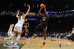 NEW YORK — DECEMBER 7: Louisville Cardinals Forward Olivia Cochran (44) shoots a jump shot against UConn Huskies Center Jana El Alfy (8) during the first half at the Barclays Center on December 7, 2024, in New York, New York. (Gregory Fisher/A Lot of Sports Talk)