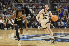 ALBANY, NEW YORK – MARCH 30:  Iowa guard CAITLIN CLARK (22) drives past Colorado defender JAYLYN SHERROD (00) during the 2024 NCAA Women’s Basketball Tournament Albany 2 Regional semifinal at MVP Arena on March 30, 2024, in Albany, N.Y.  (Scotty Rausenberger/A Lot of Sports Talk)