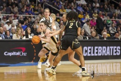 ALBANY, NEW YORK – MARCH 30:  Iowa guard CAITLIN CLARK (22) drives past Colorado defender TAMEIYA SADLER (2) during the 2024 NCAA Women’s Basketball Tournament Albany 2 Regional semifinal at MVP Arena on March 30, 2024, in Albany, N.Y.  (Scotty Rausenberger/A Lot of Sports Talk)
