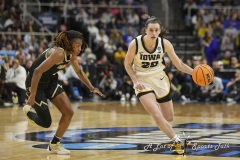 ALBANY, NEW YORK – MARCH 30:  Iowa guard CAITLIN CLARK (22) drives past a Colorado defender during the 2024 NCAA Women’s Basketball Tournament Albany 2 Regional semifinal at MVP Arena on March 30, 2024, in Albany, N.Y.  (Scotty Rausenberger/A Lot of Sports Talk)