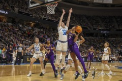 ALBANY, NEW YORK – MARCH 30:  LSU forward ANGEL REESE (10) puts up an off-balanced shot while being defended by UCLA’s ANGELA DUGALIĆ during the 2024 NCAA Women’s Basketball Tournament Albany 2 Regional semifinal at MVP Arena on March 30, 2024, in Albany, N.Y.  (Scotty Rausenberger/A Lot of Sports Talk)