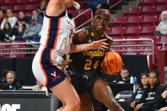 CHESTNUT HILL, MA - FEBRUARY 08: Boston College Eagles guard Dontavia Waggoner (24) drives to the basket while defended by Virginia Cavaliers forward Sam Brunelle (33) during a women’s college basketball game between the Virginia Cavaliers and the Boston College Eagles on February 8, 2024 at Conte Forum in Chestnut Hill, MA. (Photo by Erica Denhoff/Icon Sportswire)