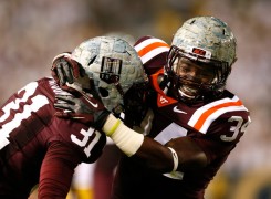 Of the Hokies' 13 interceptions this season (third in the FBS) , Brandon Facyson (l.) has four of those picks while Kyshoen Jarrett has two. (Kevin C. Cox/Getty Images)