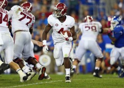 The early questions about Alabama's offensive line have gone away, as T.J. Yeldon has everaged at least six yards per carry in each of his last five games. (Andy Lyons/Getty Images)