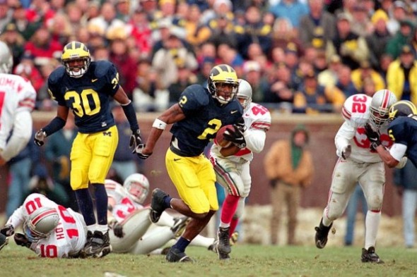 The 1997 edition between Ohio State and Michigan was the springboard for defensive back Charles Woodson to head to the top of the Heisman Trophy list. (Damian Strohmeyer/SI)