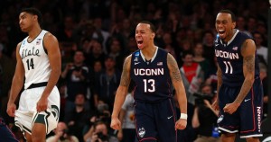East Regional MOP Shabazz Napier (13) provided the offense, while Ryan Boatright (11) had four steals against the Spartans. (Bruce Bennett/Getty Images) 