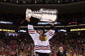Will Jonathan Toews have the honor of raising the Stanley Cup aloft once again as captain in 2015? (Bruce Bennett/Getty Images)