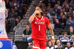 Washington, DC - March 14, 2024: North Carolina State Wolfpack guard Jayden Taylor (1) celebrates after making a shot during the quarterfinal round of the 2024 ACC Tournament between Duke and NC State at Capital One Arena in Washington, DC.  (Photo by Elliott Brown/A Lot of Sports Talk)