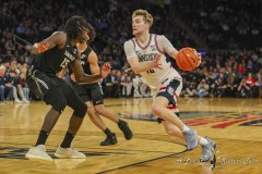 MANHATTAN, NEW YORK — March 14:   UConn guard CAM SPENCER (12) drives the lane during the first half of the Big East Tournament Quarterfinal game against Xavier at Madison Square Garden on March 14, 2024, in Manhattan, N.Y. (Scotty Rausenberger/A Lot of Sports Talk)