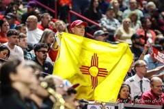 March 16, 2024: A fans holds up a New Mexico Lobos flag during the first half of the Men’s Finals of the Mountain West Conference tournament, Saturday, March 16, 2024, in Las Vegas, NV. Christopher Trim/A Lot of Sports Talk.