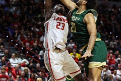 March 15, 2024: New Mexico Lobos center Nelly Junior Joseph (23) has his shot blocked by Colorado State Rams guard Rashaan Mbemba (21) during the first half of the Men’s Semifinals of the Mountain West Conference tournament, Friday, March 15, 2024, in Las Vegas, NV. Christopher Trim/A Lot of Sports Talk.