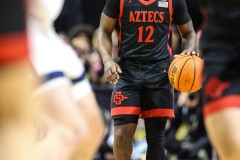 March 15, 2024: San Diego State Aztecs guard Darrion Trammell (12) brings the ball up the court during the first half of the Men’s Semifinals of the Mountain West Conference tournament, Friday, March 15, 2024, in Las Vegas, NV. Christopher Trim/A Lot of Sports Talk.