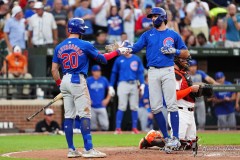 BALTIMORE — JULY 11: Chicago Cubs third baseman Miles Mastrobuoni (20) congratulates Chicago Cubs shortstop Dansby Swanson (7) for hitting a home run against the Baltimore Orioles during the sixth inning inside Oriole Park at Camden Yards on July 11, 2024, in Baltimore, Maryland. (Gregory Fisher/A Lot of Sports Talk)