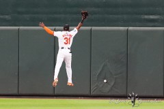 BALTIMORE — JULY 11:  Baltimore Orioles center fielder Cedric Mullins (31) attempts to making a leaping catch of Chicago Cubs right fielder Seiya Suzuki (27) RBI triple during the seventh inning inside Oriole Park at Camden Yards on July 11, 2024, in Baltimore, Maryland. (Gregory Fisher/A Lot of Sports Talk)