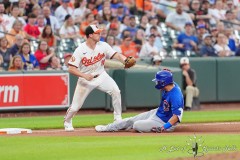 BALTIMORE — JULY 11: Chicago Cubs right fielder Seiya Suzuki (27) slides safely into third base with an RBI triple as Baltimore Orioles third baseman Jordan Westburg (11) awaits the throw during the seventh inning inside Oriole Park at Camden Yards on July 11, 2024, in Baltimore, Maryland. (Gregory Fisher/A Lot of Sports Talk)