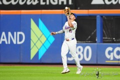 NEW YORK — JULY 29: New York Mets center fielder Tyrone Taylor (15) catches a fly ball hit by Minnesota Twins left fielder Trevor Larnach (not pictured) during the ninth  inning at Citi Field on July 29, 2024, in New York, New York. (Gregory Fisher/A Lot of Sports Talk)