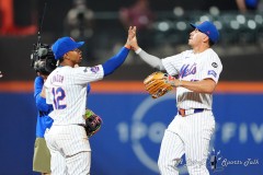 NEW YORK — JULY 29: New York Mets shortstop Francisco Lindor (12) and center fielder Tyrone Taylor (15) hi five to celebrate the victory against the Minnesota Twins after the ninth inning at Citi Field on July 29, 2024, in New York, New York. (Gregory Fisher/A Lot of Sports Talk)