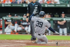 BALTIMORE — JULY 12: New York Yankees catcher Jose Trevino (39) scores a run on New York Yankees designated hitter Jahmai Jones (not pictured) RBI single against the Baltimore Orioles during the second inning inside Oriole Park at Camden Yards on July 12, 2024, in Baltimore, Maryland. (Gregory Fisher/A Lot of Sports Talk)