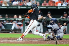 BALTIMORE — JULY 12: Baltimore Orioles third baseman Ramon Urias (29) hits an RBI triple against the New York Yankees during the second inning inside Oriole Park at Camden Yards on July 12, 2024, in Baltimore, Maryland. (Gregory Fisher/A Lot of Sports Talk)