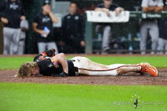 BALTIMORE — JULY 12: Baltimore Orioles right fielder Heston Kjerstad (13) lays motionless after being hit in the head by a pitch during the ninth inning against the New York Yankees inside Oriole Park at Camden Yards on July 12, 2024, in Baltimore, Maryland. (Gregory Fisher/A Lot of Sports Talk)