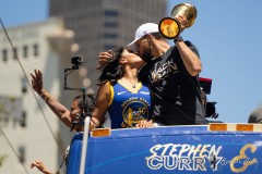 Ayesha Curry and Steph Curry kiss on a float during the Golden State Warriors Championship Parade in San Francisco, California on June 20, 2022.